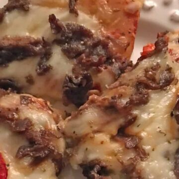 Cheesesteak pizza recipe slices on plate