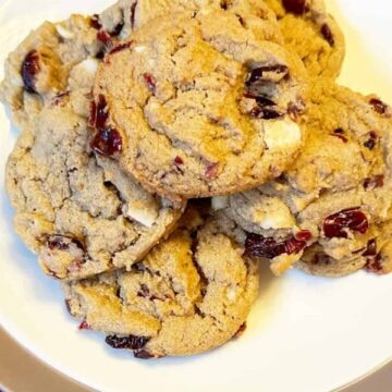 Gluten and Dairy Free Cranberry and Macadamia Nut Cookies in a plate