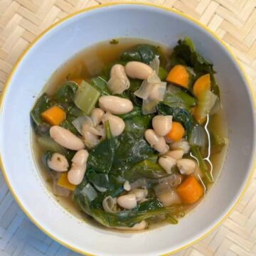 bowl with Tuscan Bean Soup Recipe in it