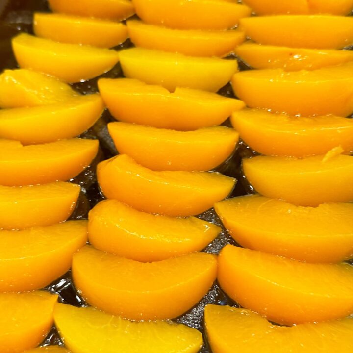 Lay peaches on baking pan in one layer