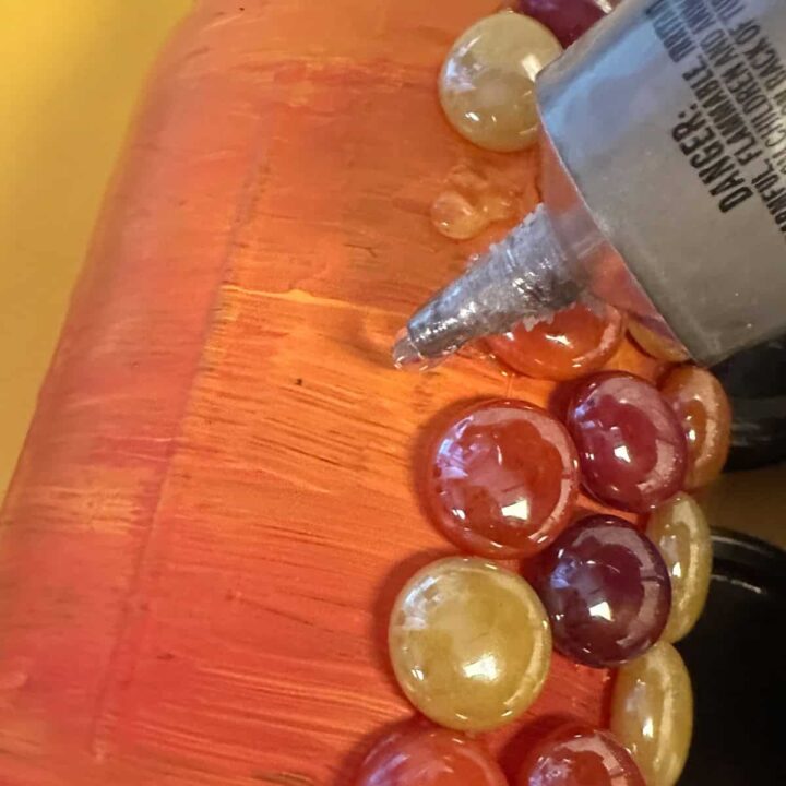 glue the gems to the mason jar