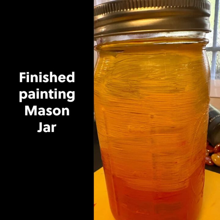 Mason jar painted with a title to the left that says finished painting mason jar