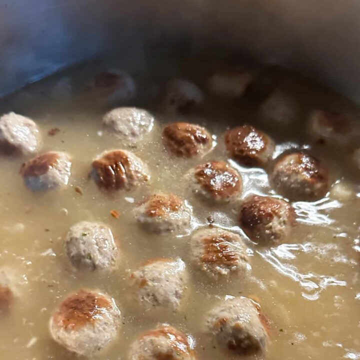 meatballs and broth in a pot