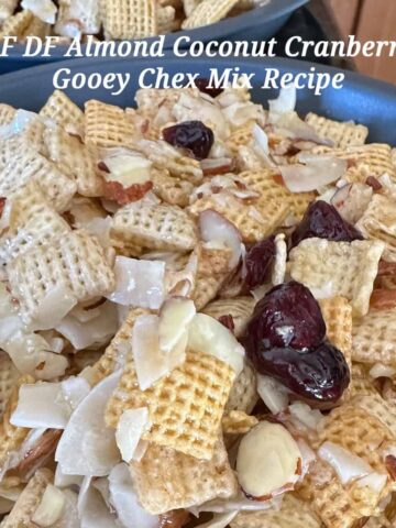 DF GF Coconut Almond Cranberry Chex Mix on a plate with title overlay