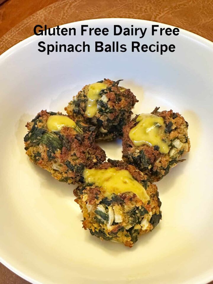 4 spinach balls in a white bowl with title overlay for pinterest