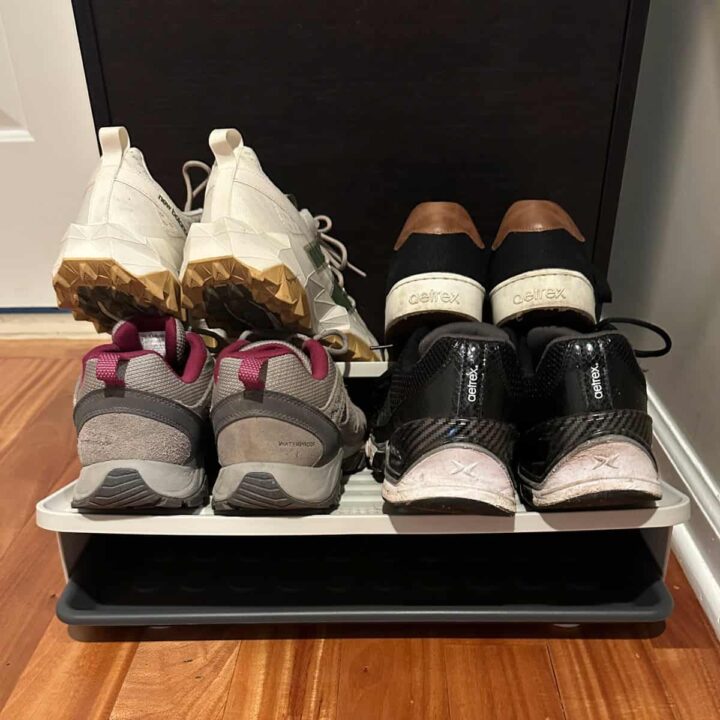 tray and shoes and tiered that are holding the shoes