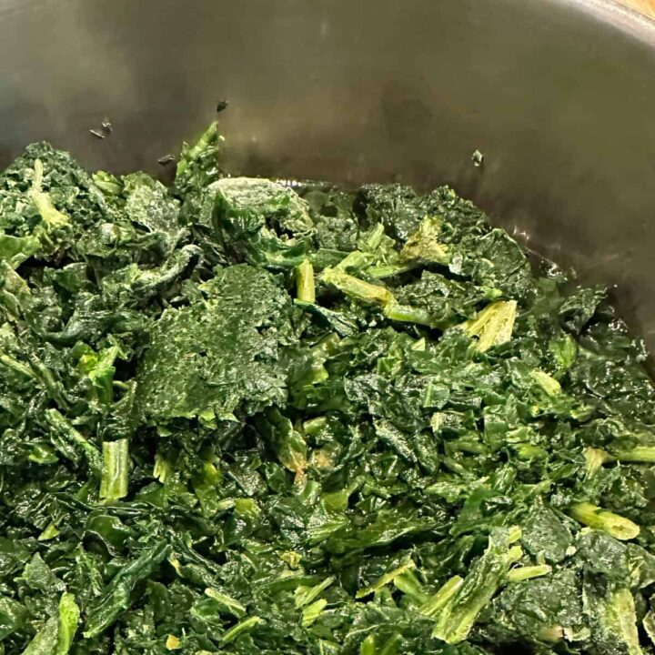 Cooked spinach chopped in a pot