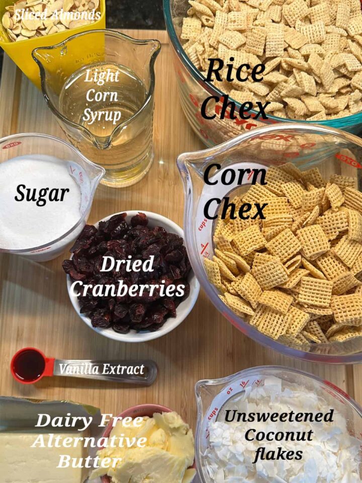 DF GF Coconut Almond Cranberry Chex Mix ingredients laid on a cutting board