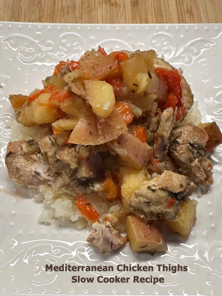 Title at the bottom and white plate with serving size of this Mediterranean Chicken Thighs Slow Cooker Recipe