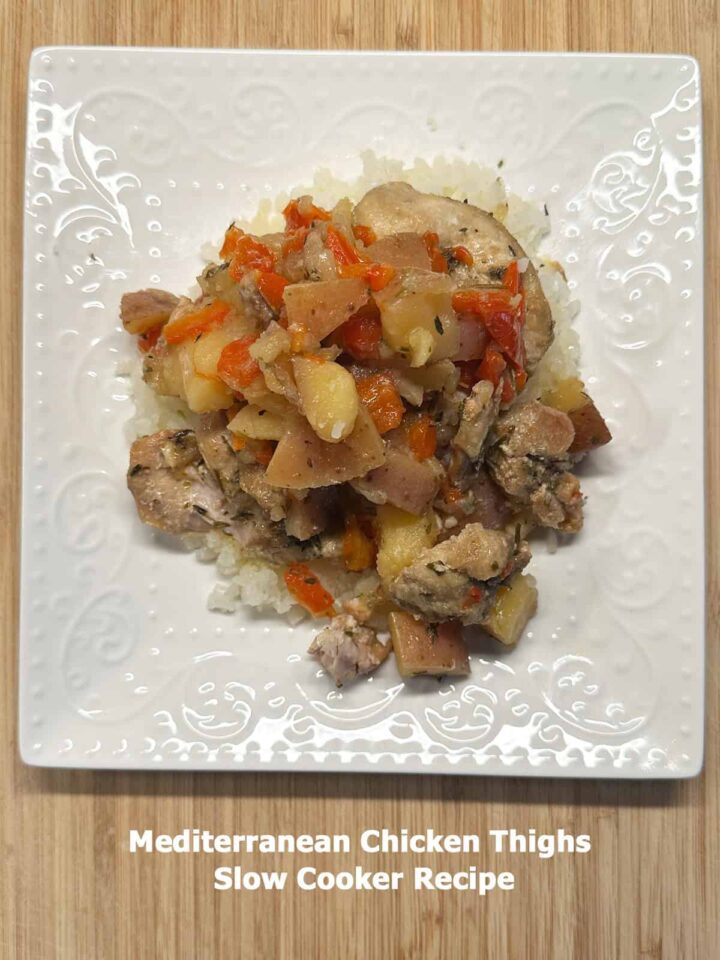 Title at the bottom and white plate with serving size of this Mediterranean Chicken Thighs Slow Cooker Recipe