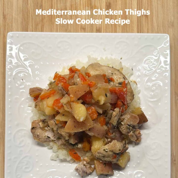 Title at the top and white plate with serving size of this Mediterranean Chicken Thighs Slow Cooker Recipe