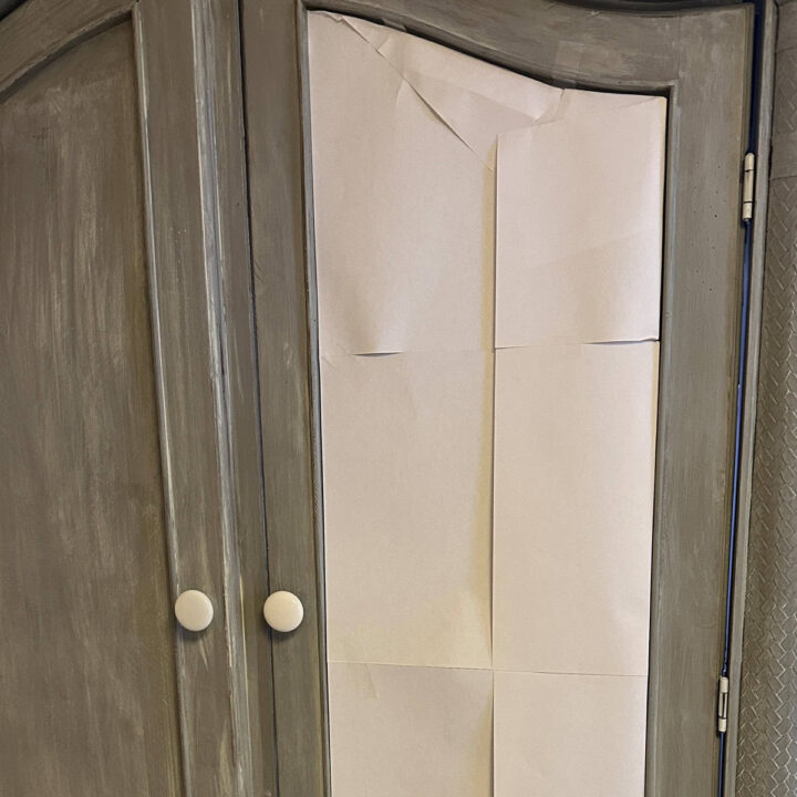 Fold the pieces of excess paper inside the door groves and tape