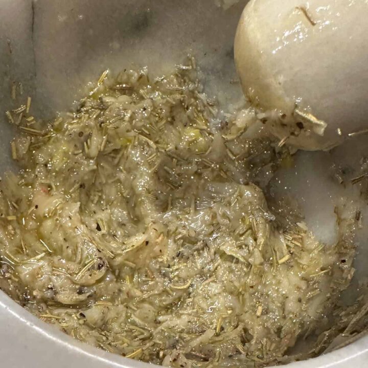 Mashed Roasted Garlic Paste in a marble mortar and Pestle