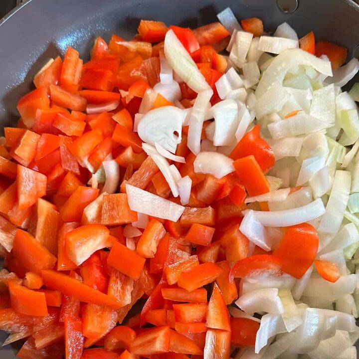 peppers and onions in a skillet