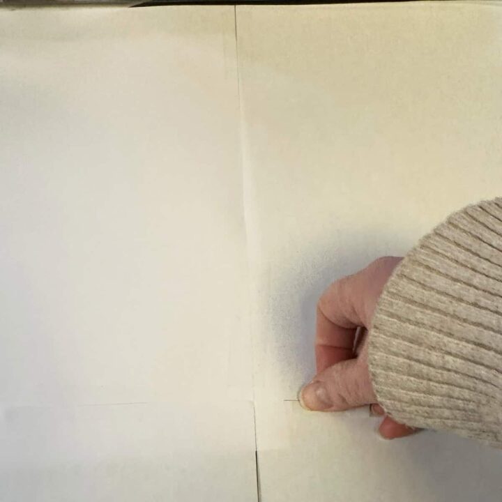 Tape the paper together with a hand