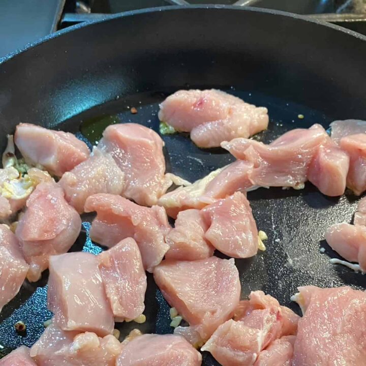 chicken breast cubed on skillet