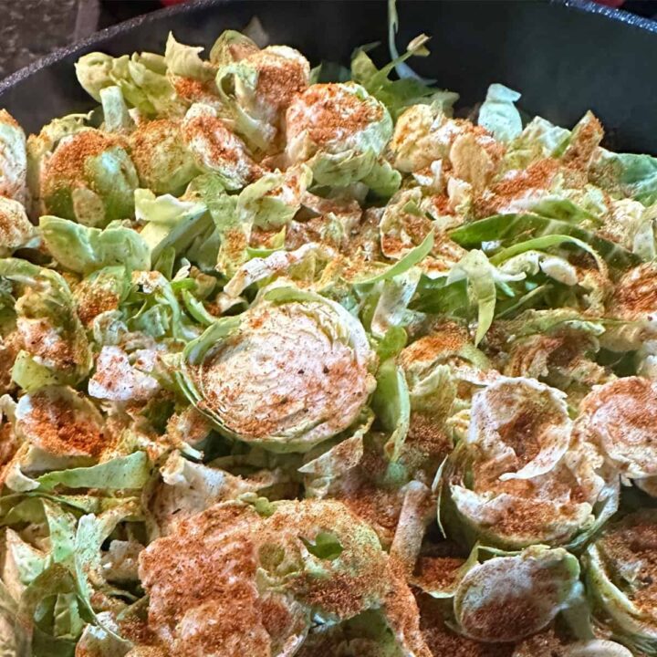 raw shredded brussel sprouts in skillet