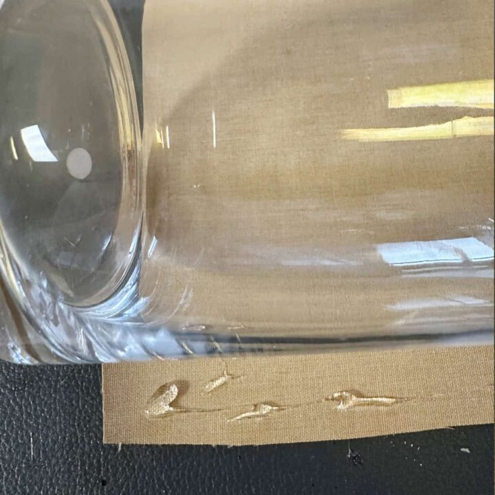 glass vase on its side with glue on cork fabric