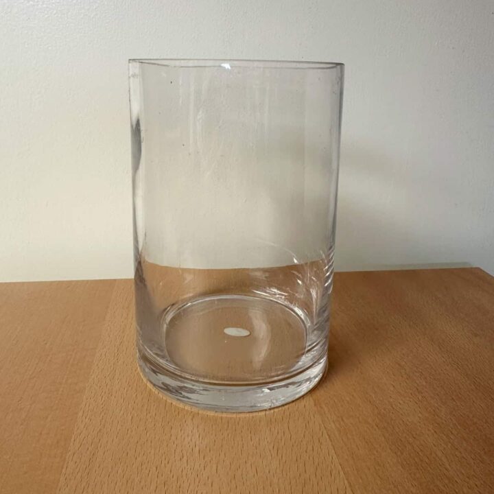 A GLASS cylinder on a table