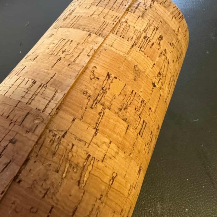 fabric glued on glass jar showing the seam.