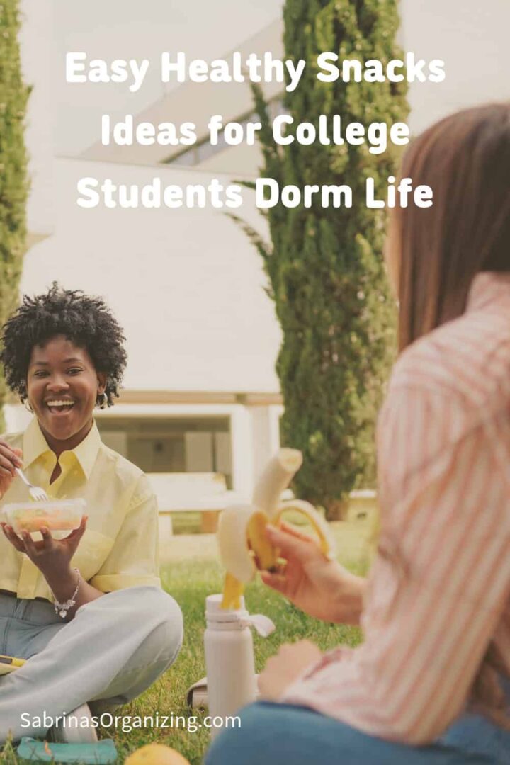 two girls eating a healthy snack on the grass - title at the top middle - pinterest image size