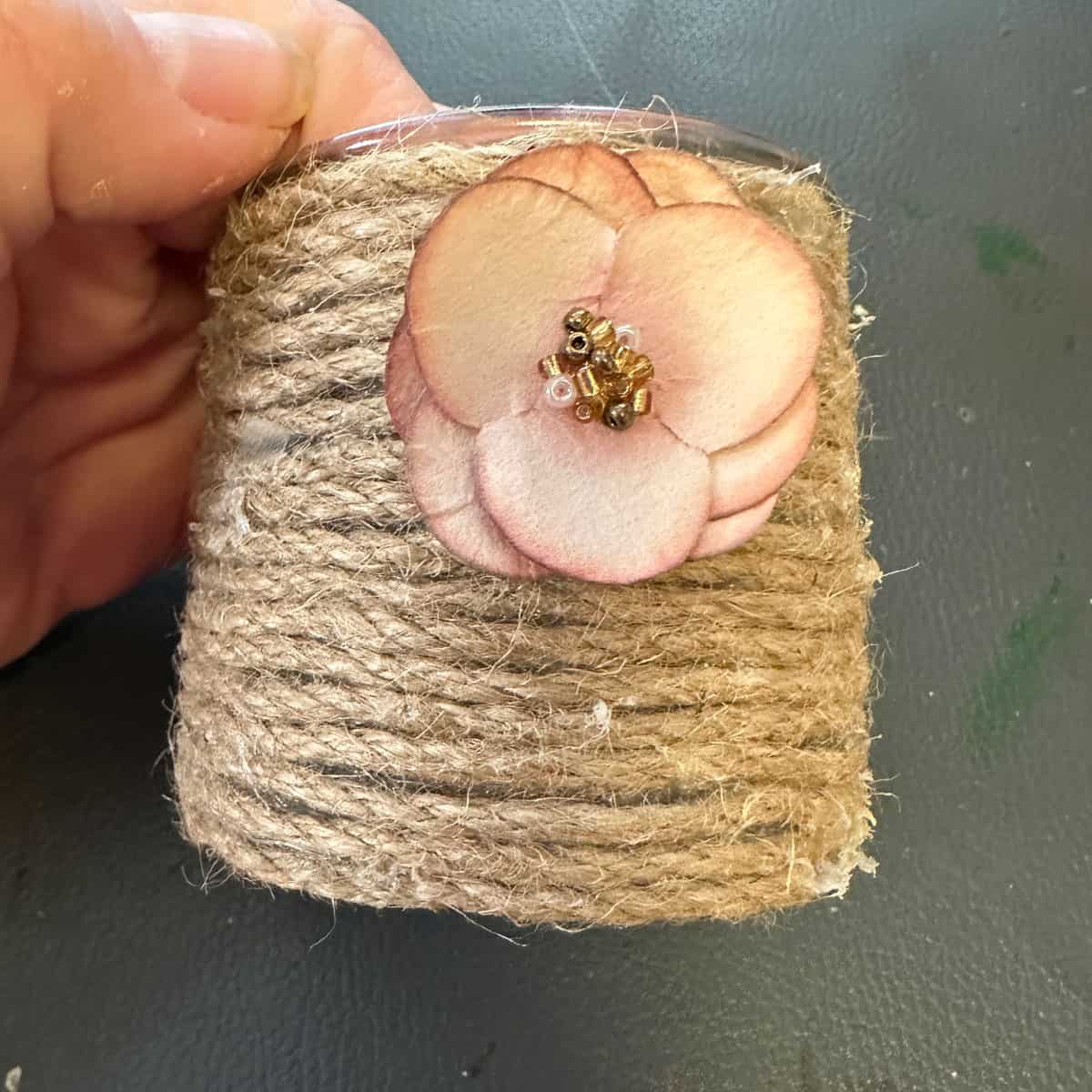add paper flower to jute rope - square image