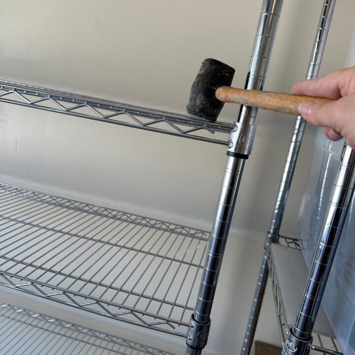 Using the rubber mallet and securing the shelves square image