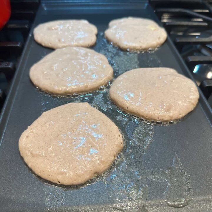 wet pancakes on griddle