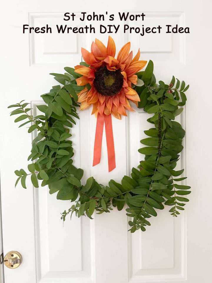finished Wreath on the wall pinterest image - title of post at the top center