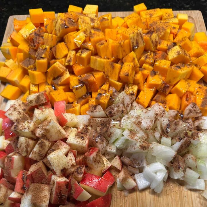 adding apple pie spice to apple onions and butternut squash - square image