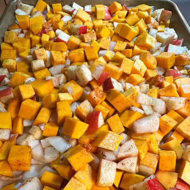 cut up raw ingredients for this recipe in a baking sheet