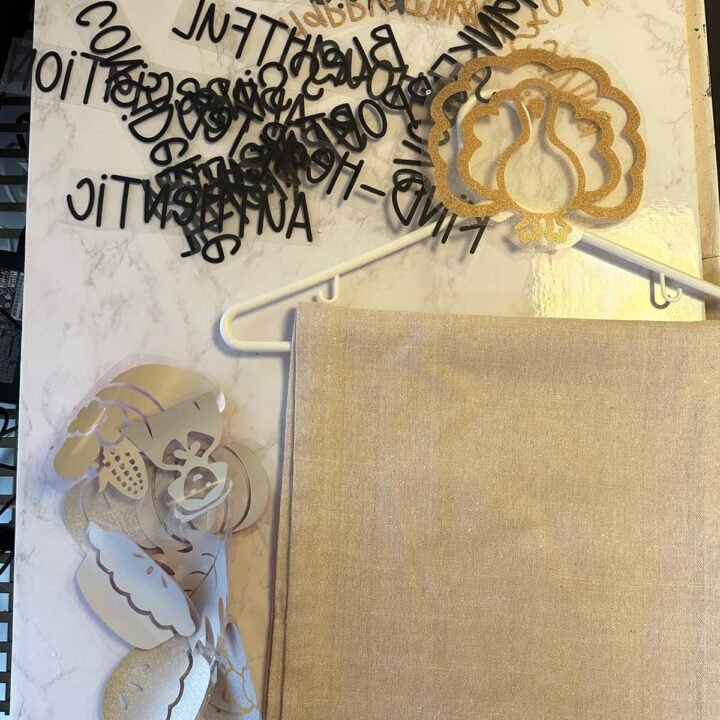 shows the supplies of words and images and the runner on a hanger that I used for this project - square image