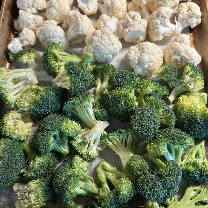 Broccoli and cauliflower on baking sheet square image