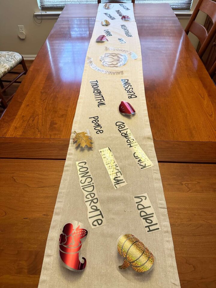 The full runner that shows the words and images where they will be places on the entire table - pinterest size image