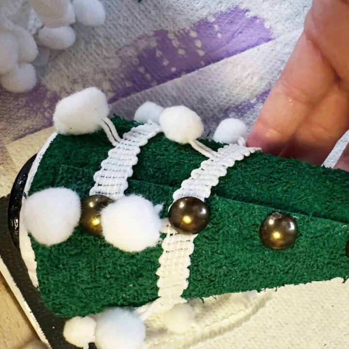 ribbon white, white tacks and green felt wrapped around a cone - square image