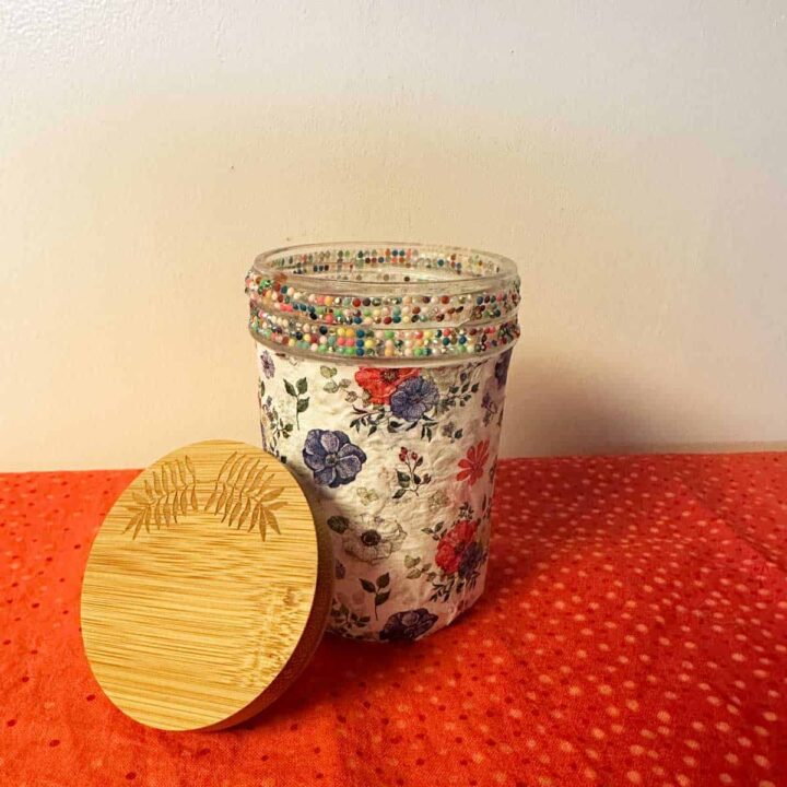 no title just finished mason jar on orange fabric and cream background. square image