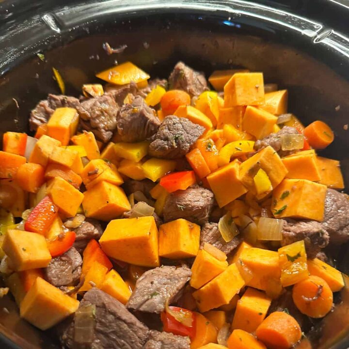 cooked meat in the slow cooker before cooking in the slow cooker - square image