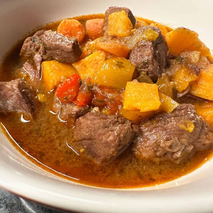 finished bowl of stew with title at the top - pinterest image
