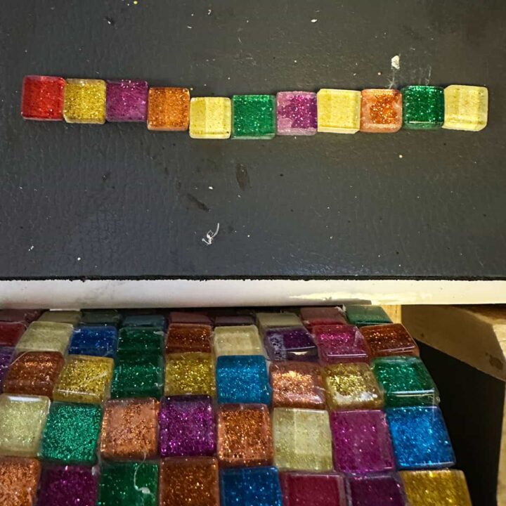 glass tile in a row on the desk and the tin can started gluing glass tile image - square image