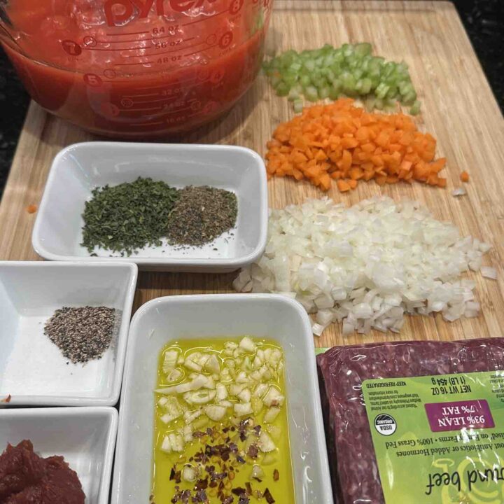 Easy Beef Ragu Recipe - all the ingredients cut up on a cutting board.
