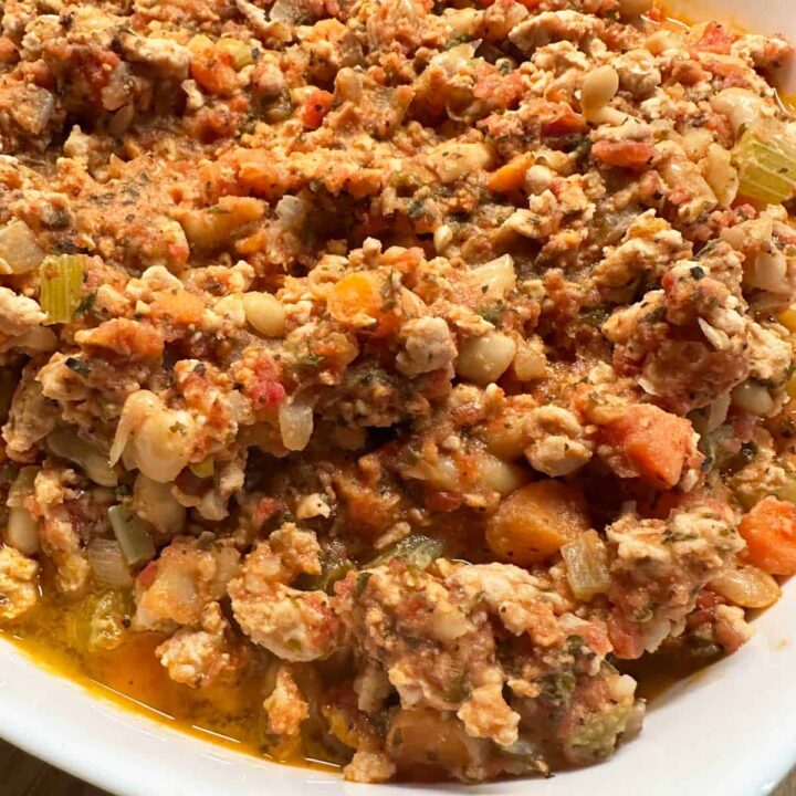 Turkey Ragu recipe in a platter pinterest image - title at the bottom of the image