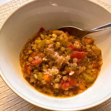 Square image - soup in a bowl with a spoon