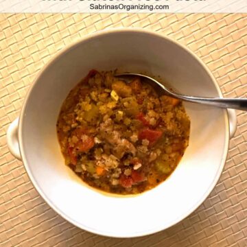 Pinterest image - soup in a bowl with a spoon - title at the top center in a white background