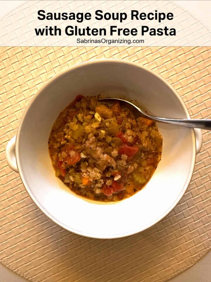 Pinterest image - soup in a bowl with a spoon - title at the top center in a white background