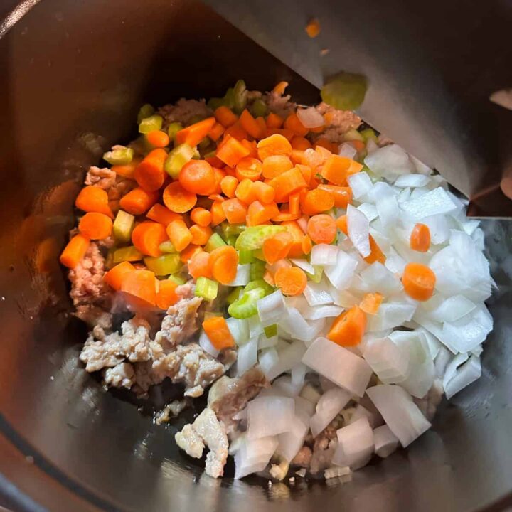 celery carrots and onions in saucepan - square image