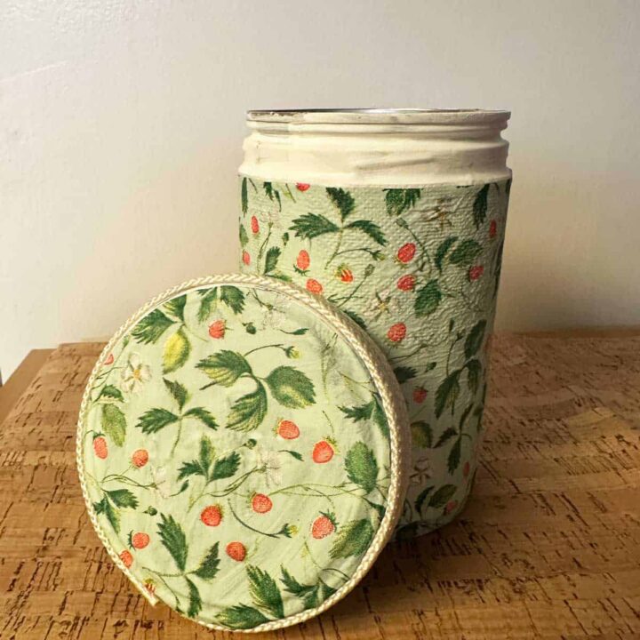 finished coffee can and lid on its side in front of the coffee can on a cork bottom - square image