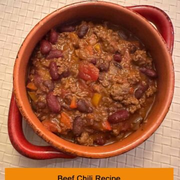 Title at the bottom - beef chili in a bowl with handles. pinterest image