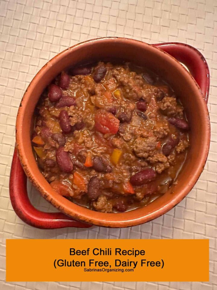 Title at the bottom - beef chili in a bowl with handles. pinterest image