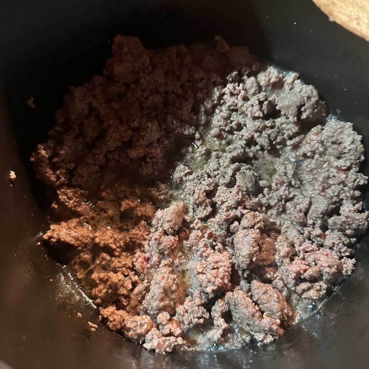 beef meat browned in sauce pan - square image