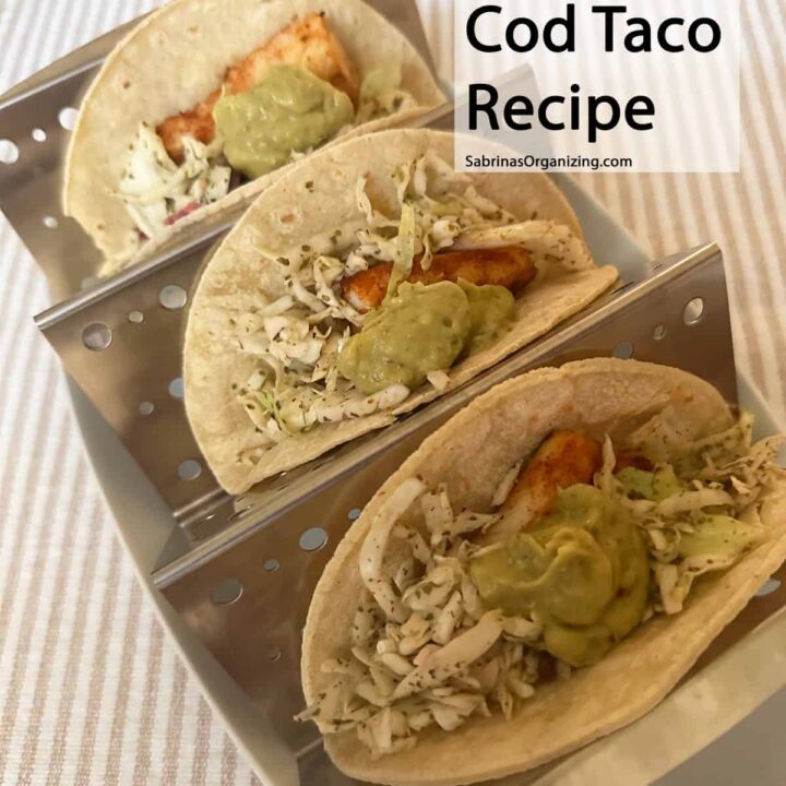 square image - Baja cod tacos in a taco holder - title that the top right - pinterest image